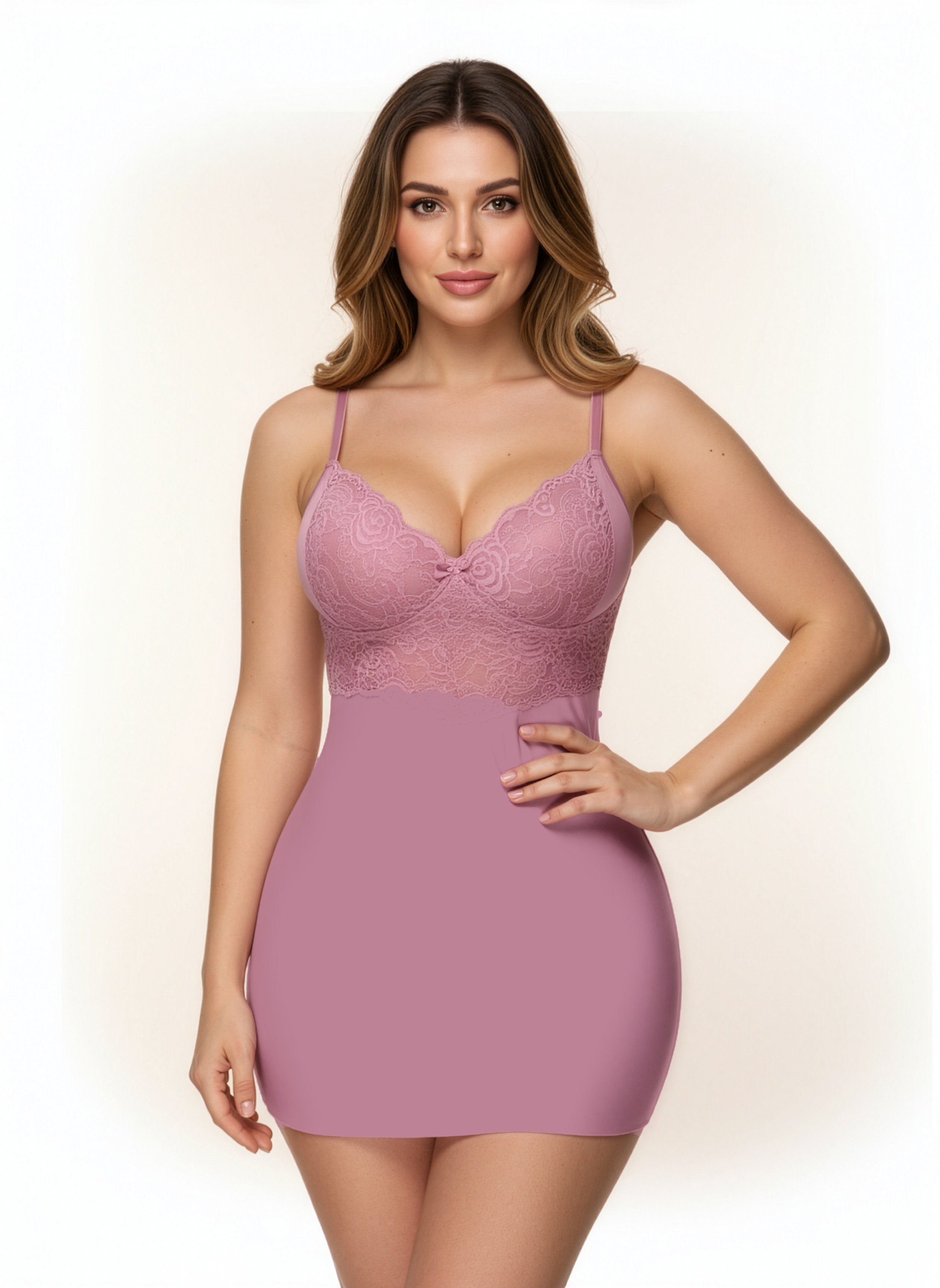 Woman wearing a pink lace dress against a plain background